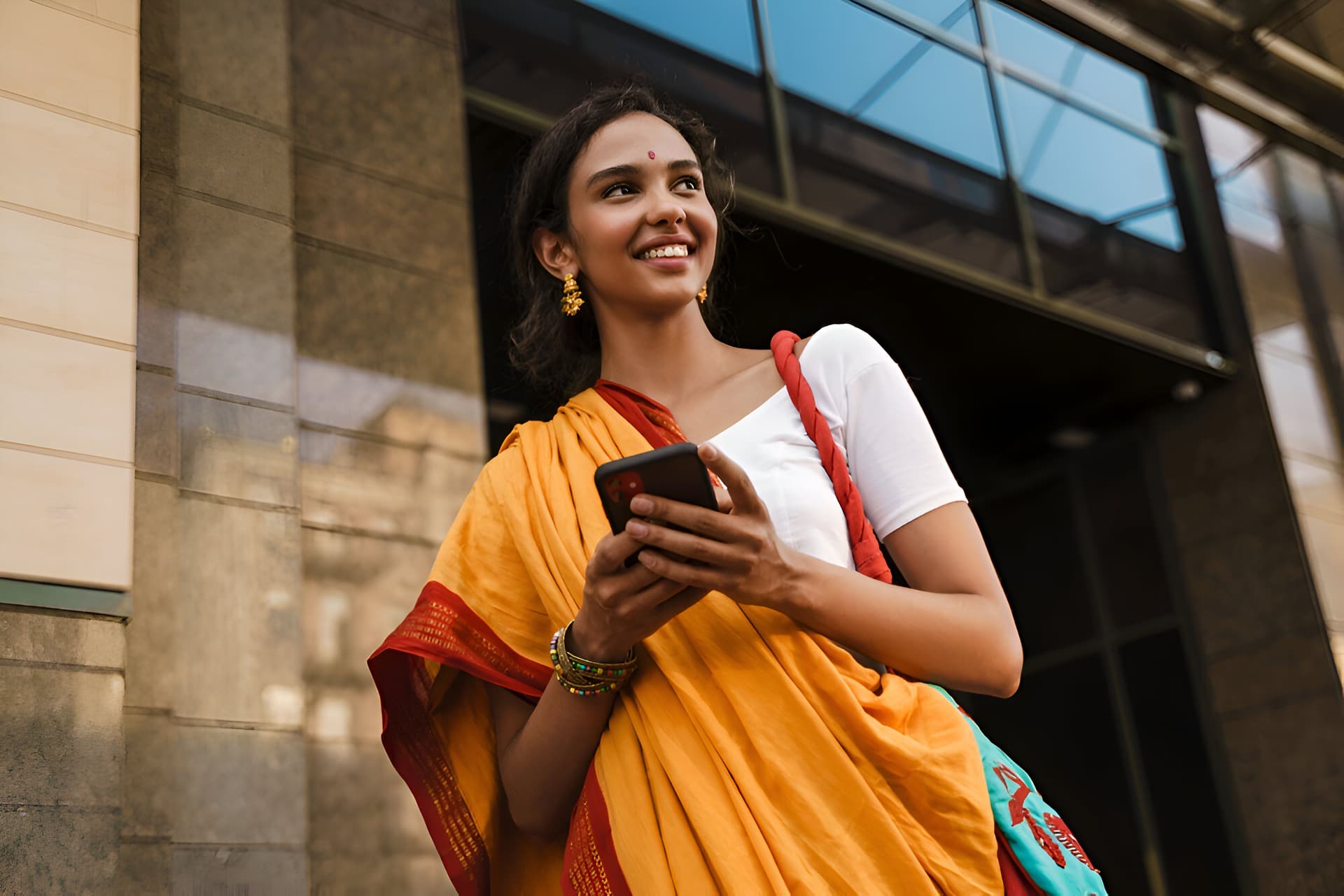 Woman in india enjoy stable mobile internet with prepaid sim 